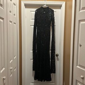 Brand New with tags. Blk Size Medium Fashion nova Maxi Gown.